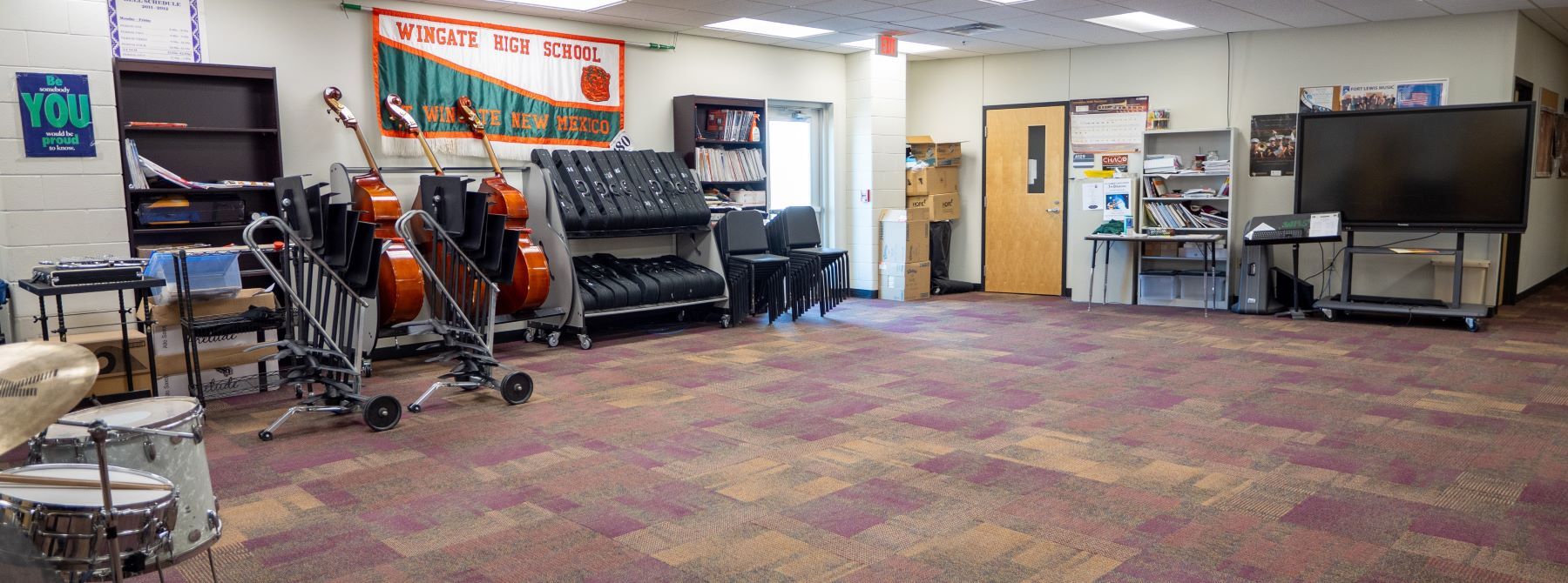 School's music room showcasing different musical instruments and gear.
