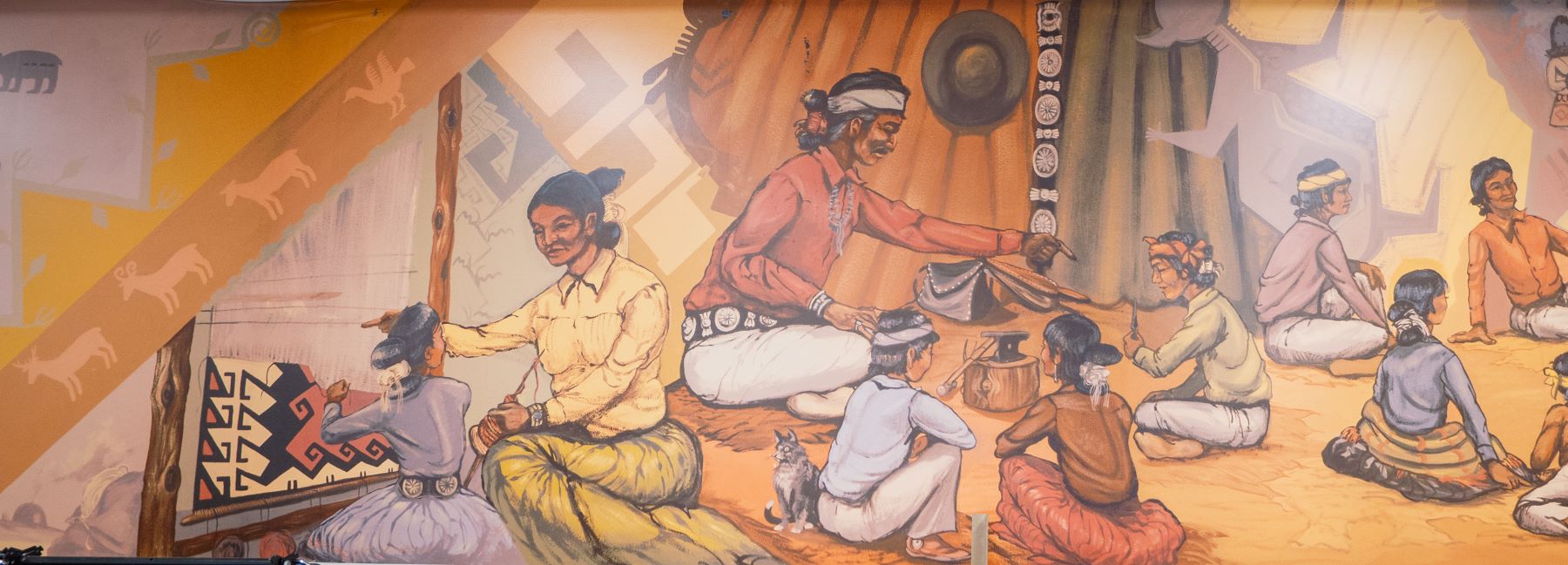 A colorful mural showing adults engaged in teaching children various cultural pastimes..